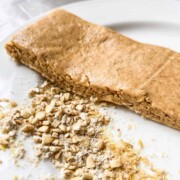 Peanut Butter Protein Bar shown with Oats and Flax Meal on a white plate