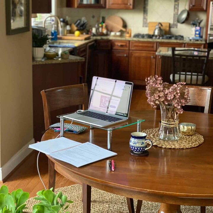 Image of laptop on kitchen table and set up for blogging.