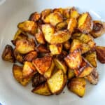 Crispy Oven Roasted Potatoes on a white plate.