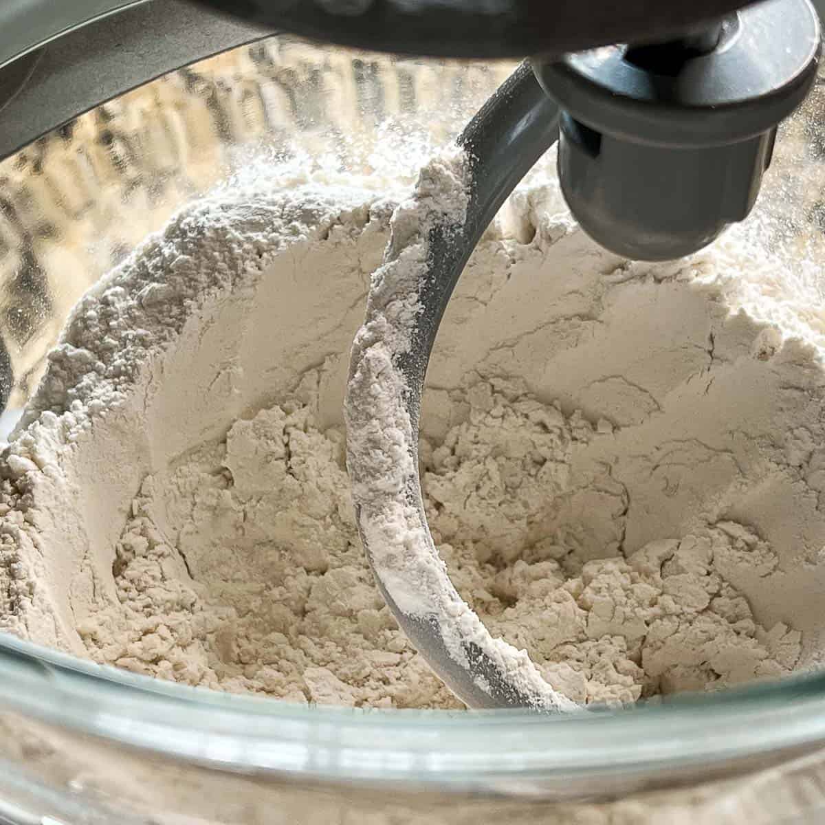 Image showing dough being brought together by dough hook in stand mixer.