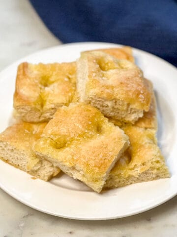 Image showing a plate full of sliced focaccia bread.