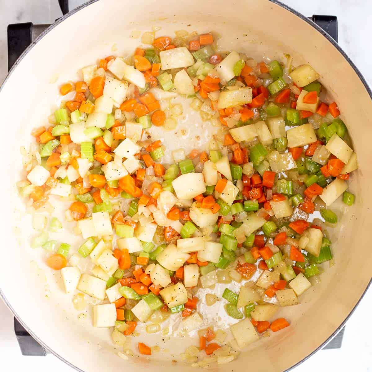 Image showing vegetables being sauteed in a dutch oven.