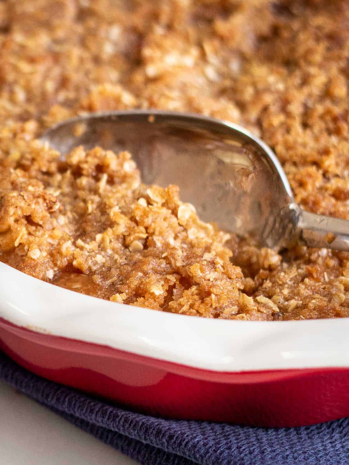 Image showing baked Apple Crisp with serving spoon.