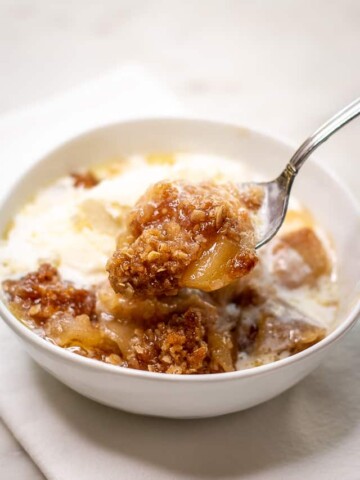 Image showing apple crisp topped with vanilla ice cream.