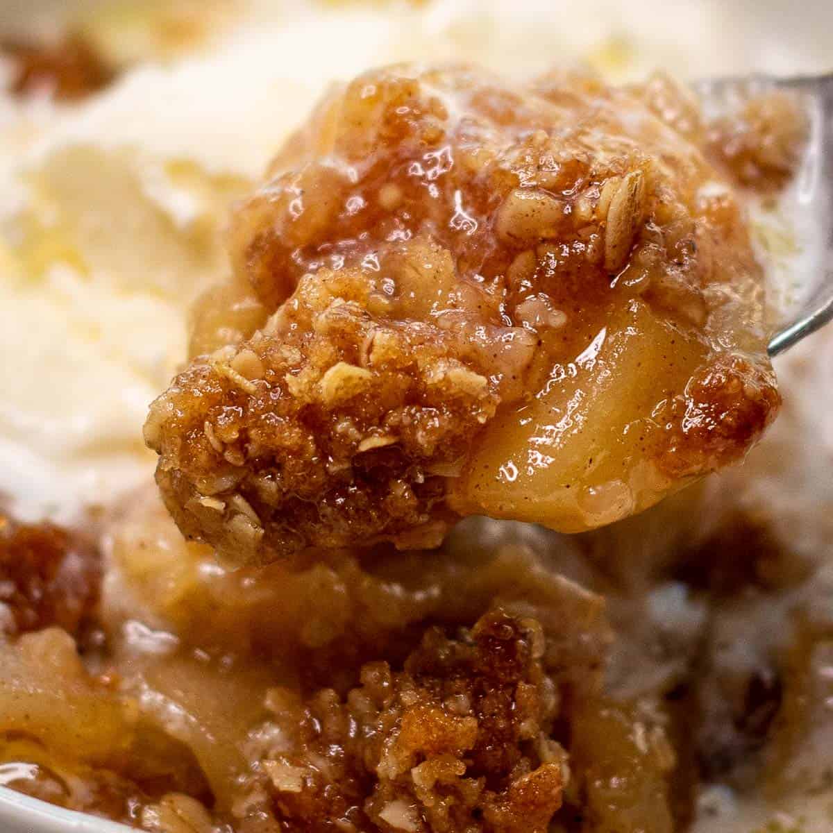 Image showing a close up of a spoonful of apple crisp.