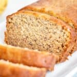 Old Fashioned Banana Bread loaf with slice shown.
