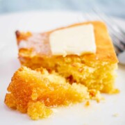 Piece of the Best Jiffy Cornbread Recipe with butter on top.