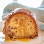 Slice of Old Fashioned Apple Cake with Bourbon Glaze.