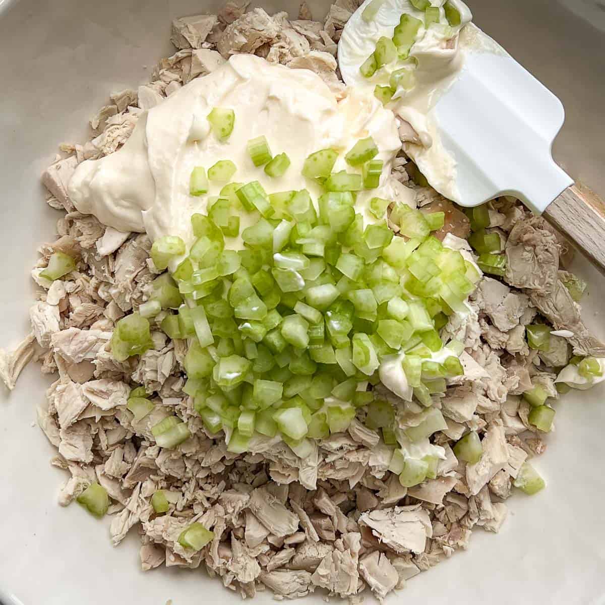 Diced celery added on top of mayo and cut up rotisserie chicken.