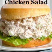 Classic Chicken Salad Sandwich on a brioche bun and garnished with lettuce.