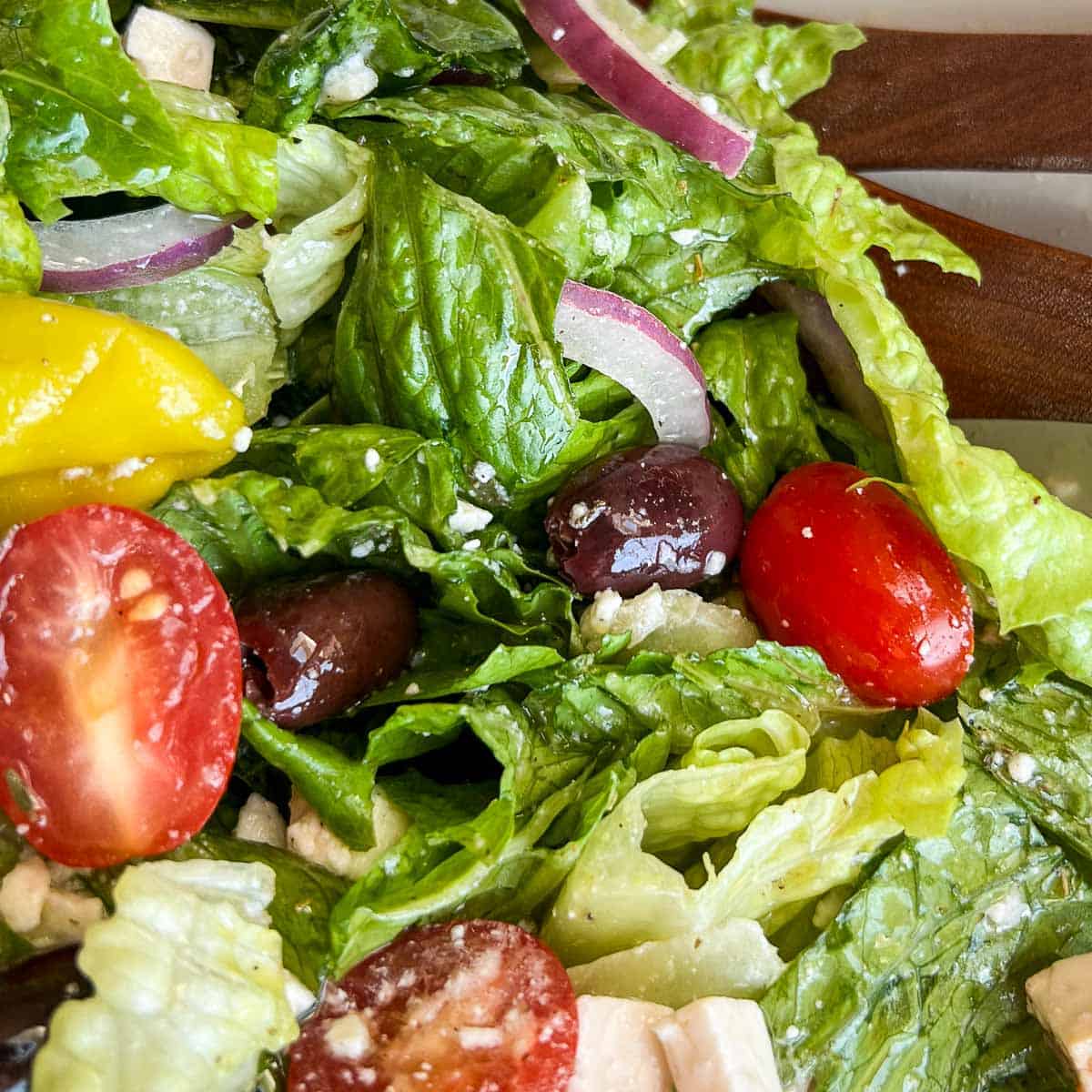 Copycat Panera Greek Salad tossed all together with dressing..