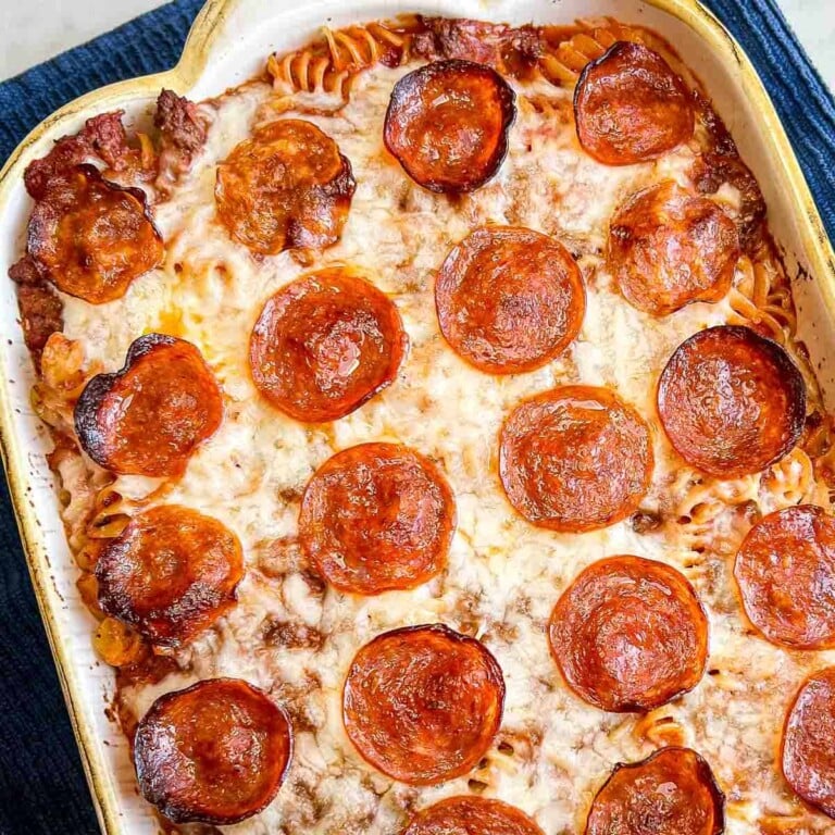 Pizza casserole topped with pepperoni in a baking dish.