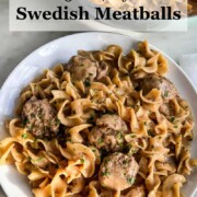 One pot Swedish meatballs on a white plate with pot in upper right corner.