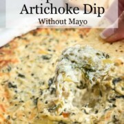 Chip dipped into spinach artichoke dip.