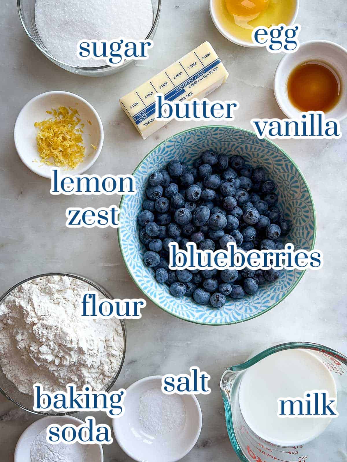 Individual ingredients for blueberry buckle cake batter.