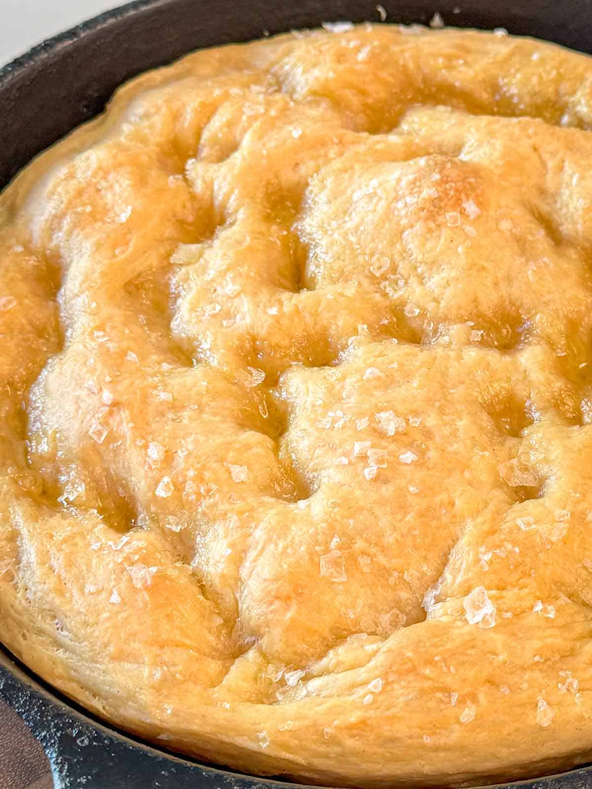 Homemade focaccia bread baked in a cast iron skillet.