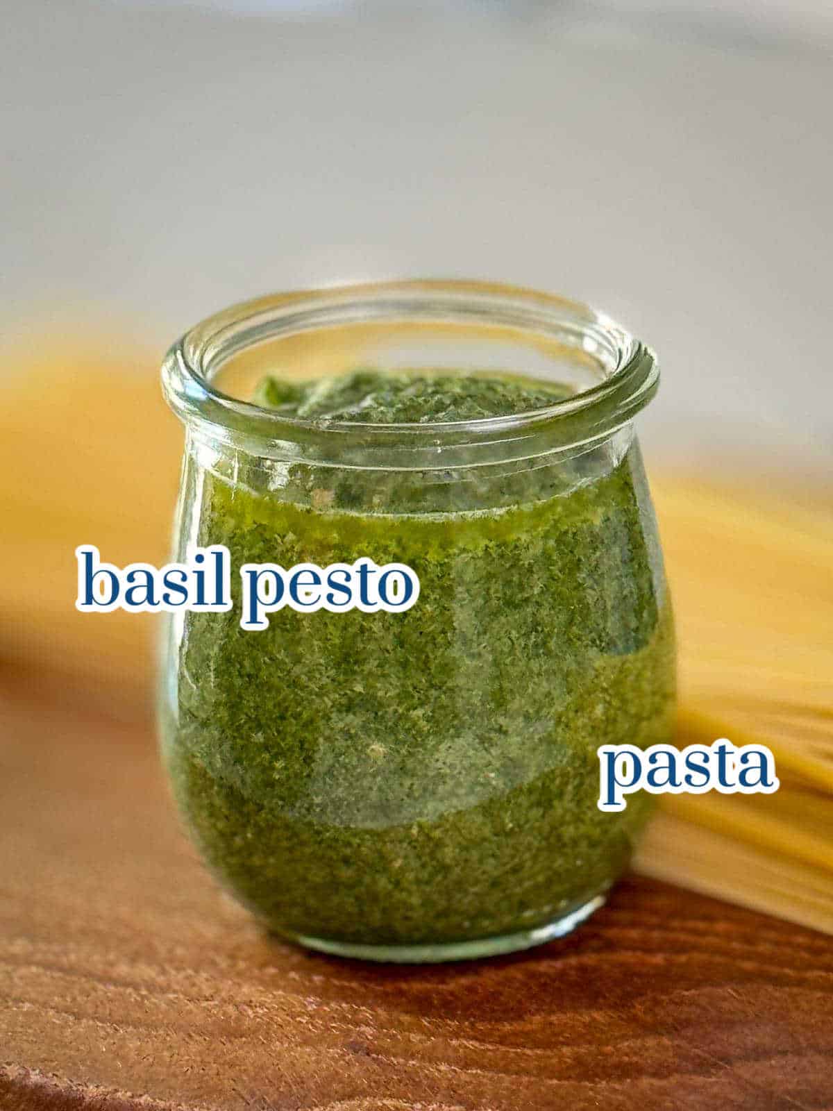 Ingredients for basil pesto pasta recipe including pasta, homemade pesto.
