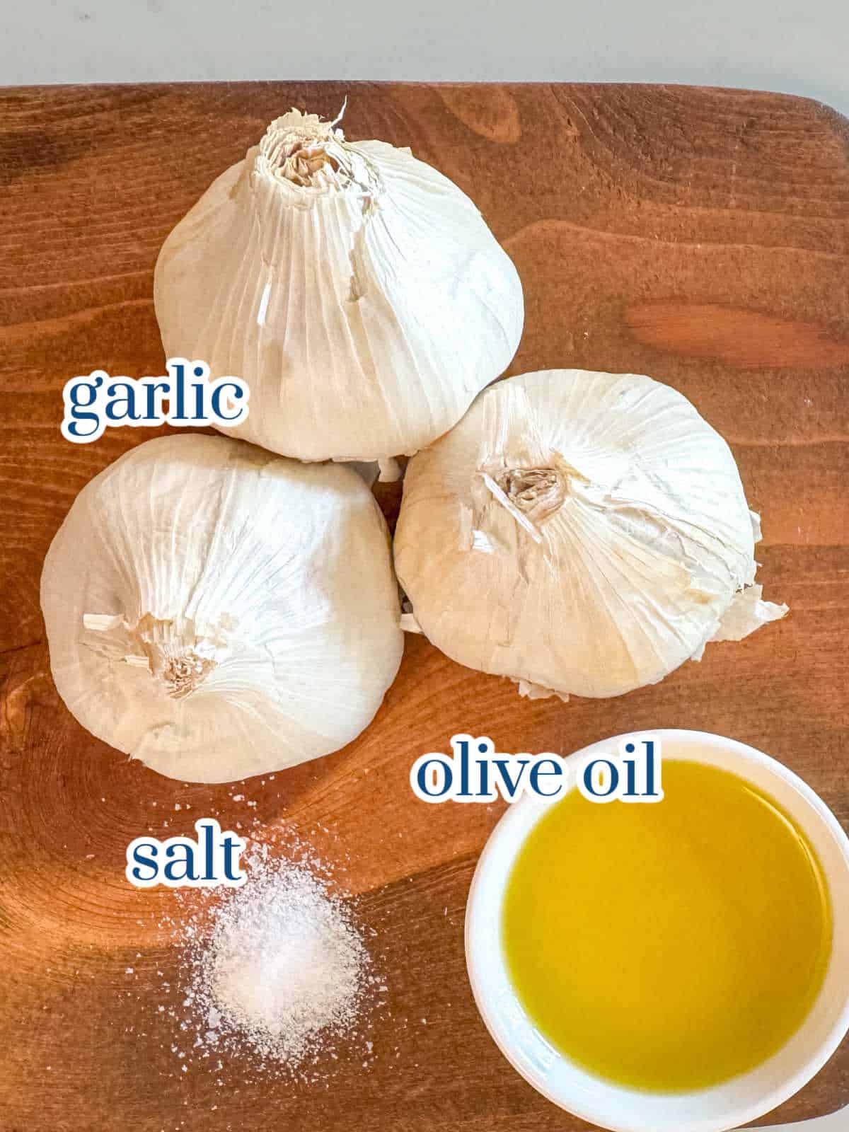Individual ingredients for roasted garlic recipe.