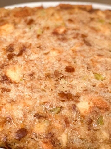 Baked bread stuffing with a golden, lightly crisp top.