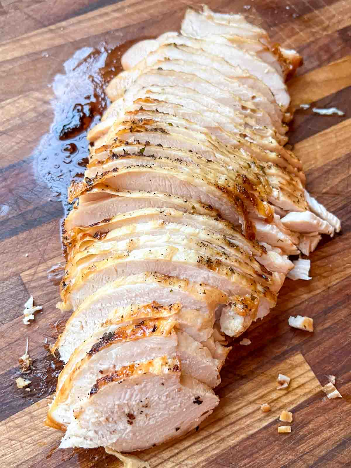 Sliced Thanksgiving turkey arranged on a serving platter.