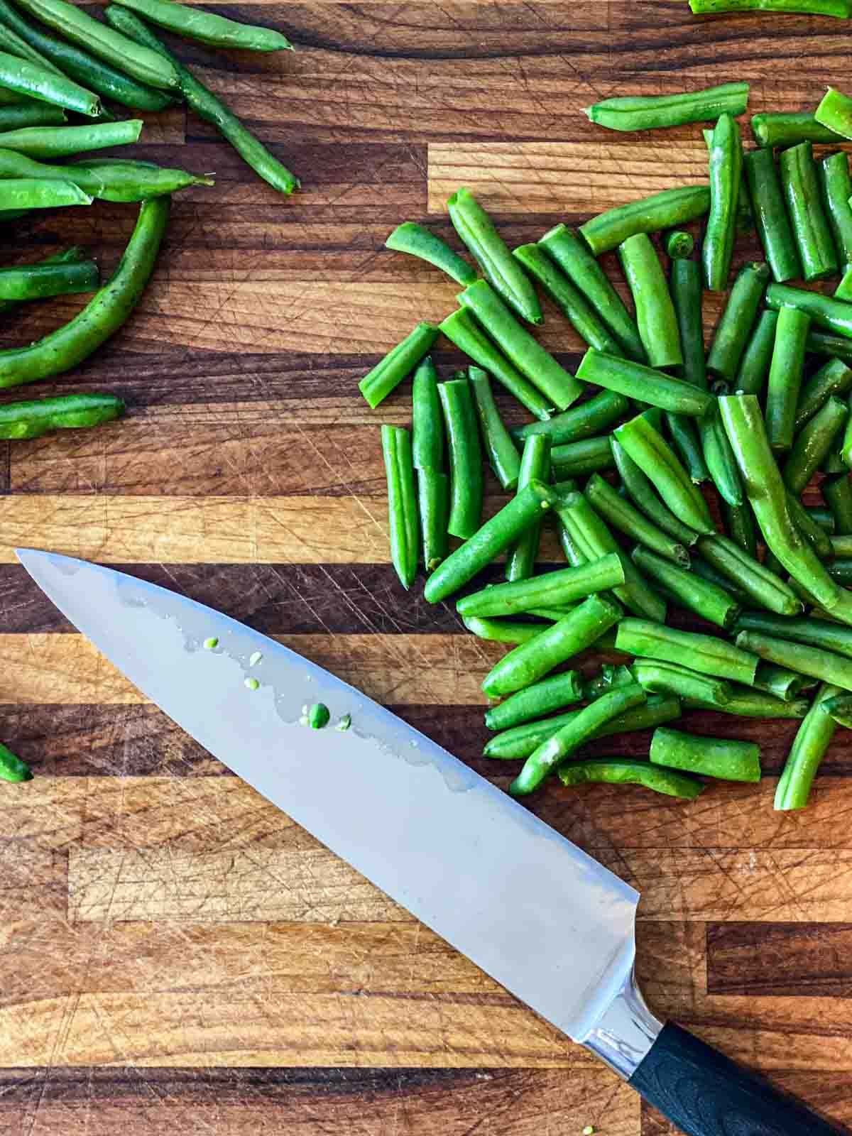 Fresh green beans trimmed and cut into bite-size pieces for green bean casserole.