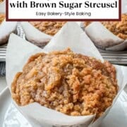 Bakery-style pumpkin streusel muffin with a soft pumpkin center beside a tray of muffins topped with buttery brown sugar streusel.