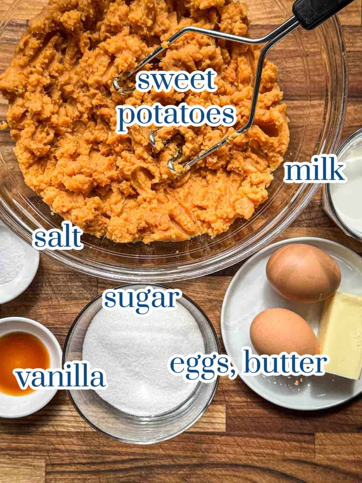 Sweet potato casserole ingredients with mashed sweet potatoes, eggs, butter, sugar, milk, and vanilla.