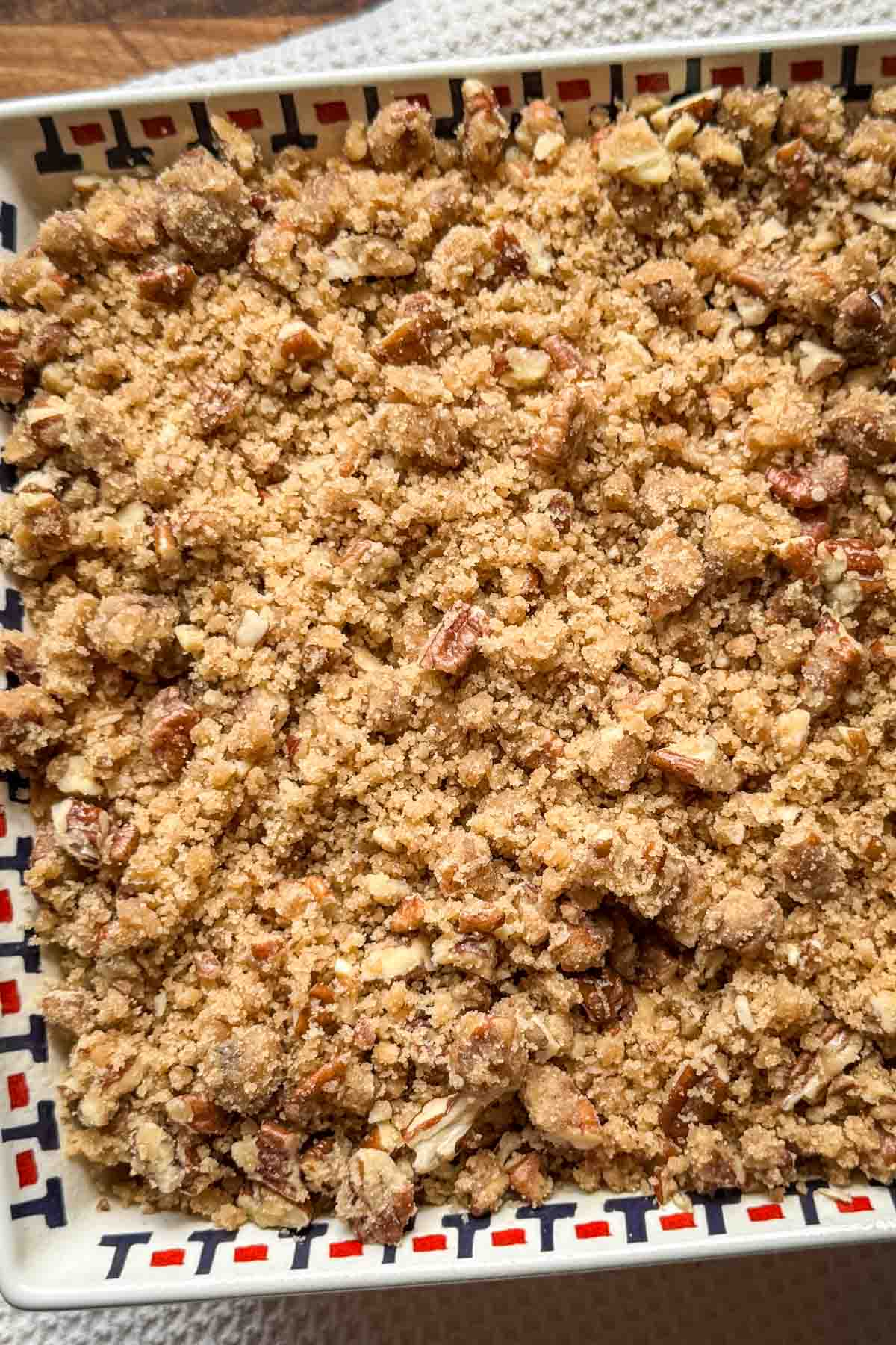 Unbaked sweet potato casserole covered with brown sugar pecan topping.